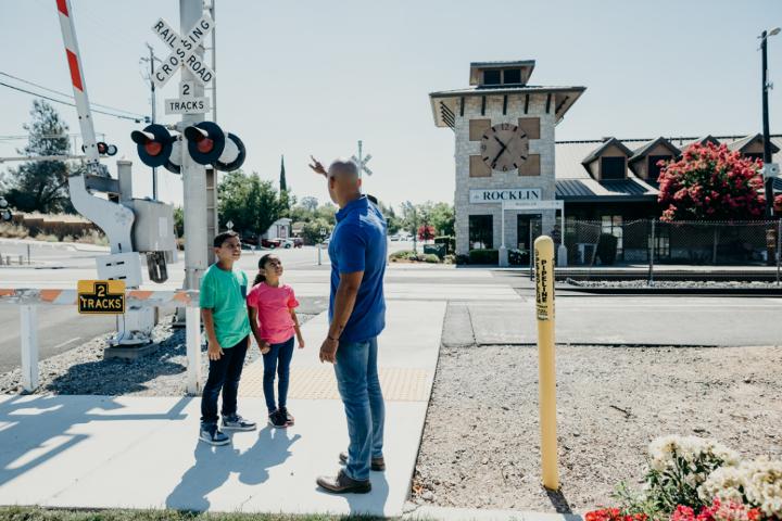 Family at a railroad crossing